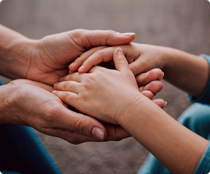 Community support and human connection Hands joined together in a gesture of support and care