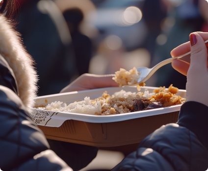 Sharing meals at a community event Serving food to people during a community gathering